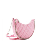 side view of a quilted crescent shaped crossbody bag with a chain embellishment