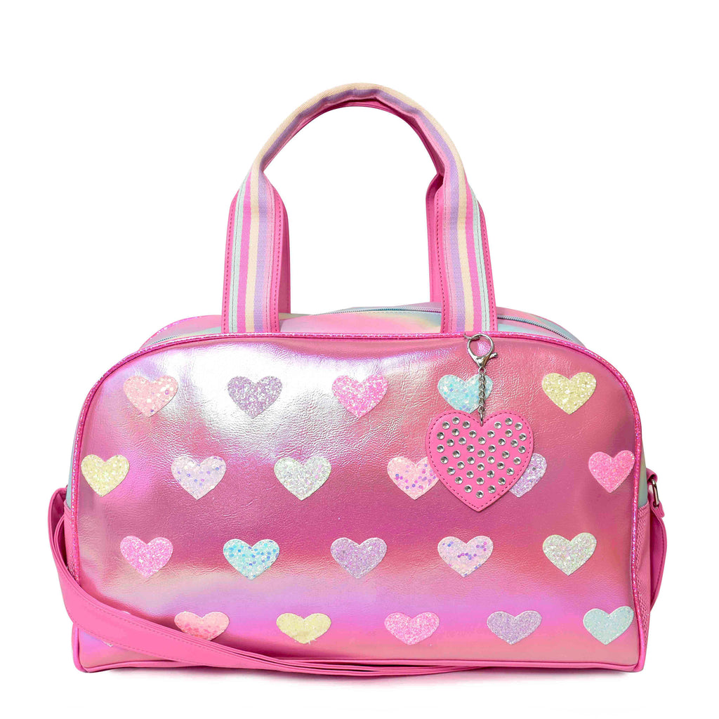 Front view of pink metallic heart-patched large duffle bag with rhinestone heart keychain