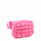 side  view of a hot pink quilted scrunch fanny pack with front zipper pocket
