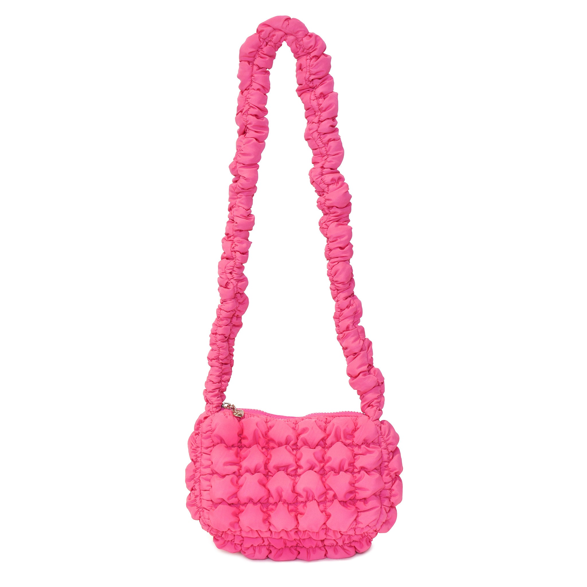 front view of a nylon quilted long handle crossbody bag in hot pink
