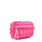 side view of a hot pink quilted puffer pouch