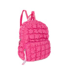 side view of a hot pink nylon quilted mini backpack with a beaded zipper