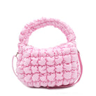 front view of a quilted puffer light pink  mini hobo crossbody bag