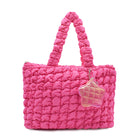 front view of a hot pink quilted large tote with star coin purse