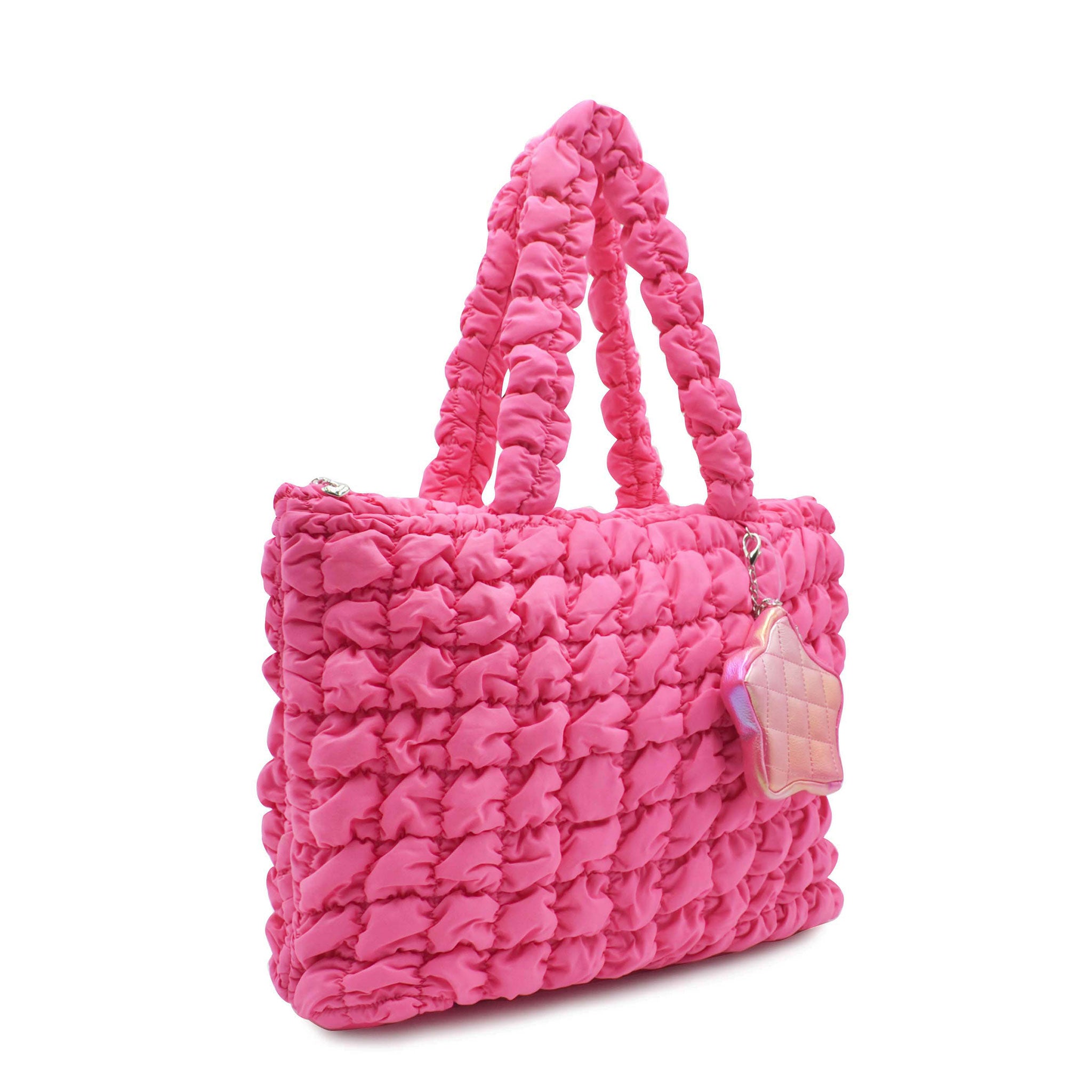 side view of a hot pink quilted large tote with star coin purse