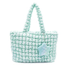 front view of a light aqua nylon quilted large tote bag with star coin purse