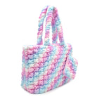 Side view of an icy ombre nylon quilted large tote bag with a detachable coin purse 
