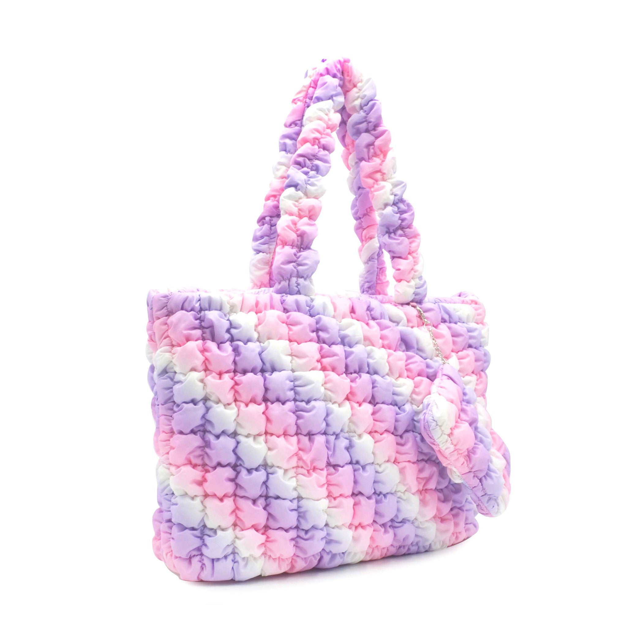 side view of a pink purple and white nylon quilted large tote bag with matching coin purse