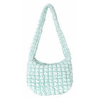 side view of a light aqua colored quilted nylon hobo style crossbody sling bag