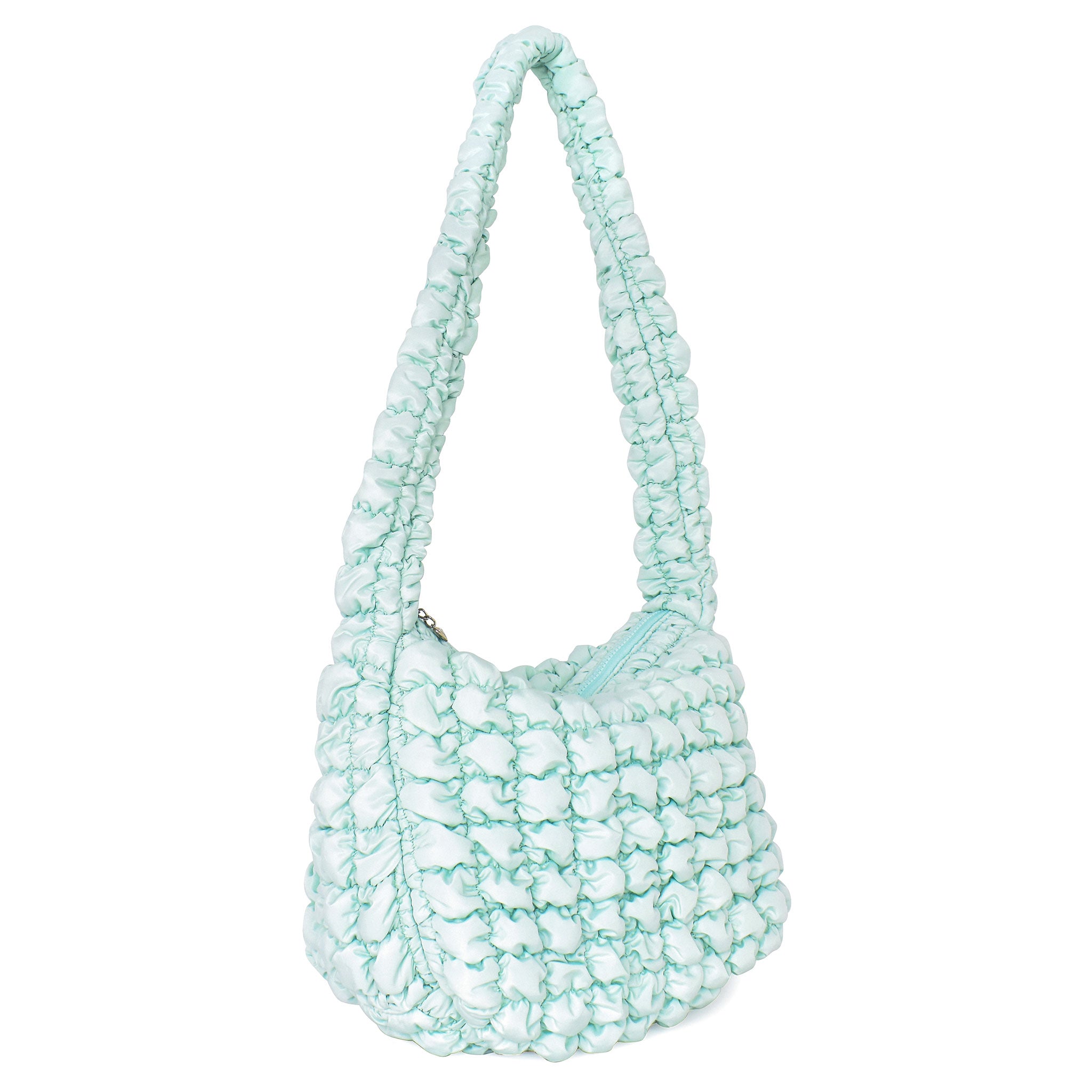 side view of a light aqua colored quilted nylon hobo style crossbody sling bag