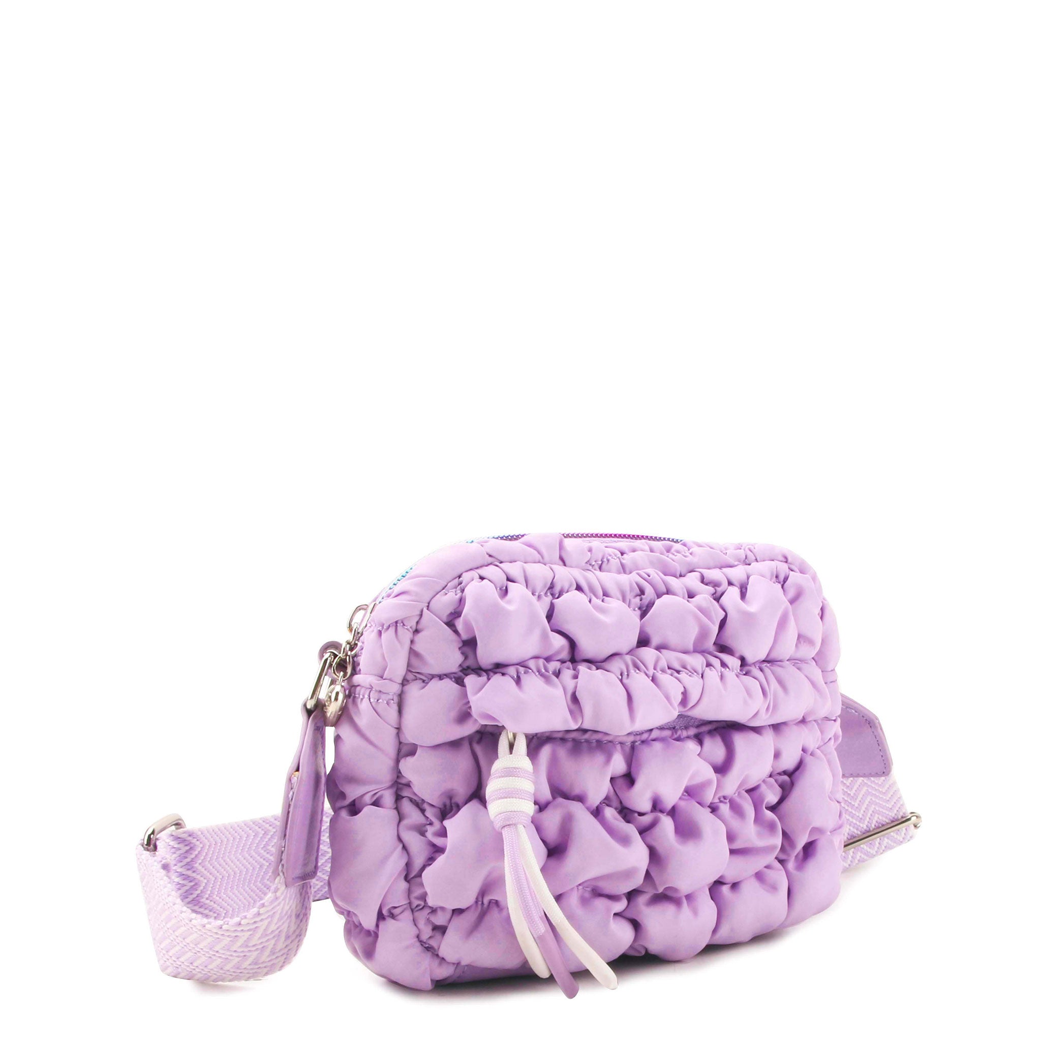 side view of a lavender quilted nylon crossbody bag with a sports zipper pocket 