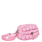 Side view of a pink nylon quilted mini crossbody bag with drawstring closure and a heart strap
