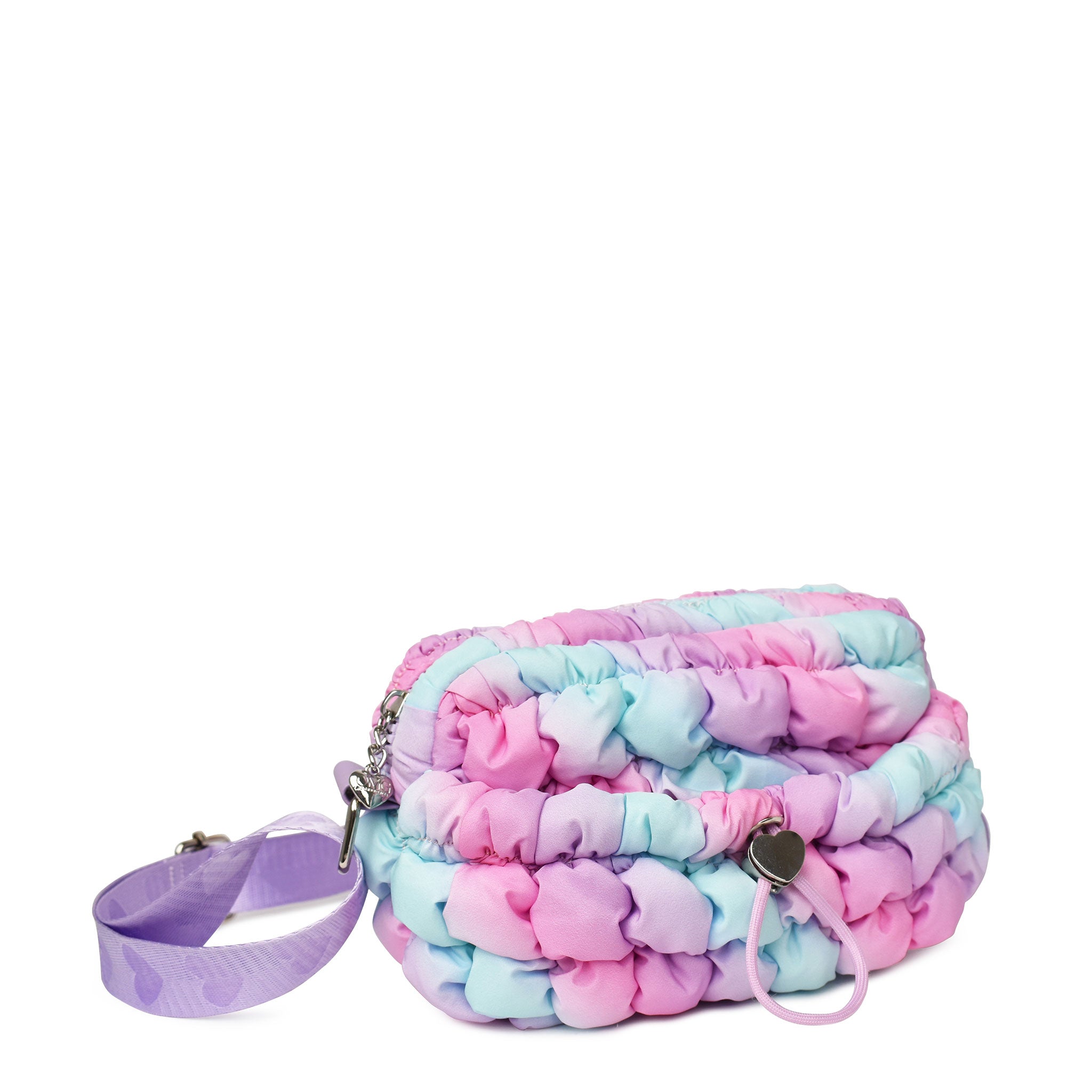 side  view of an ombre nylon quilted mini crossbody bag with drawstring closure and a heart strap