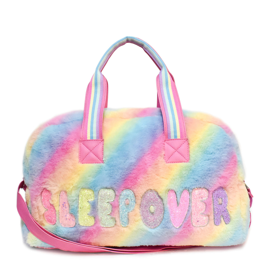 Front view of large plush ombre 'sleepover' duffle with glitter bubble-letter patches