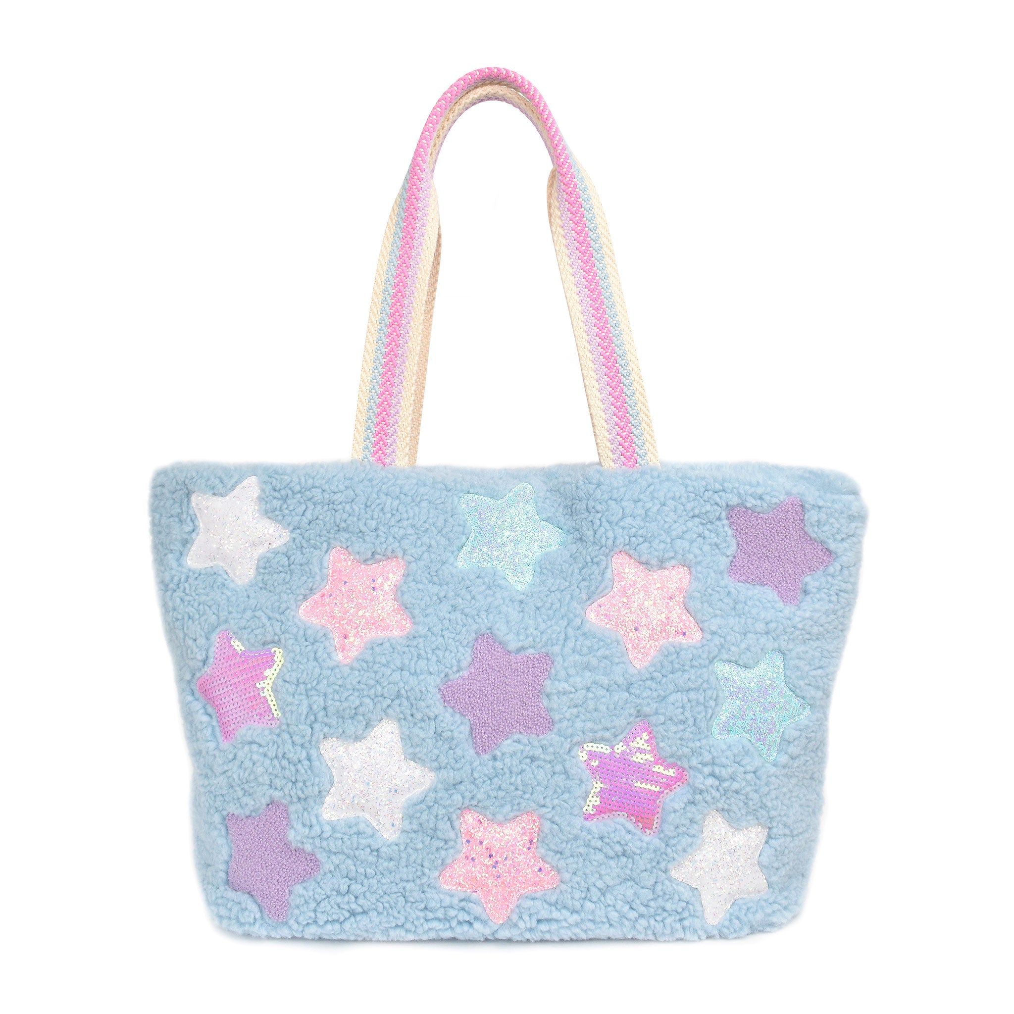 Front view of a blue sherpa large tote bag covered in sequin, chenille, and glitter star patches