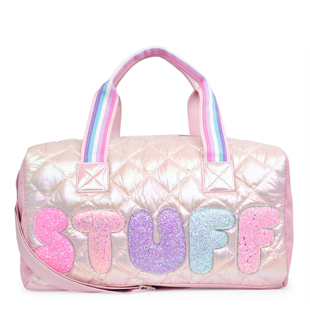 Front view of a light pink metallic quilted duffle with glitter bubble letters 'STUFF' appliqué