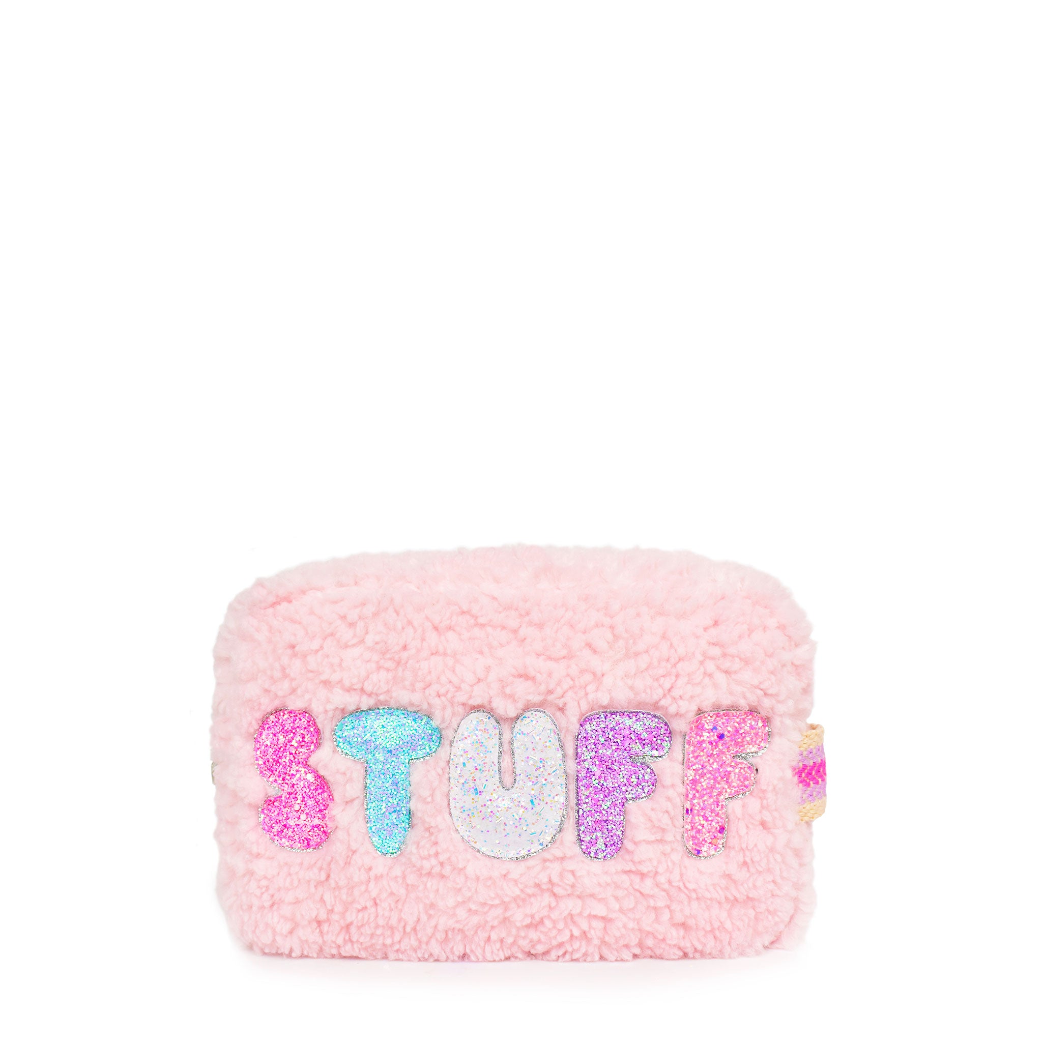 front view of pink sherpa pouch with bubble lettering 'stuff' 