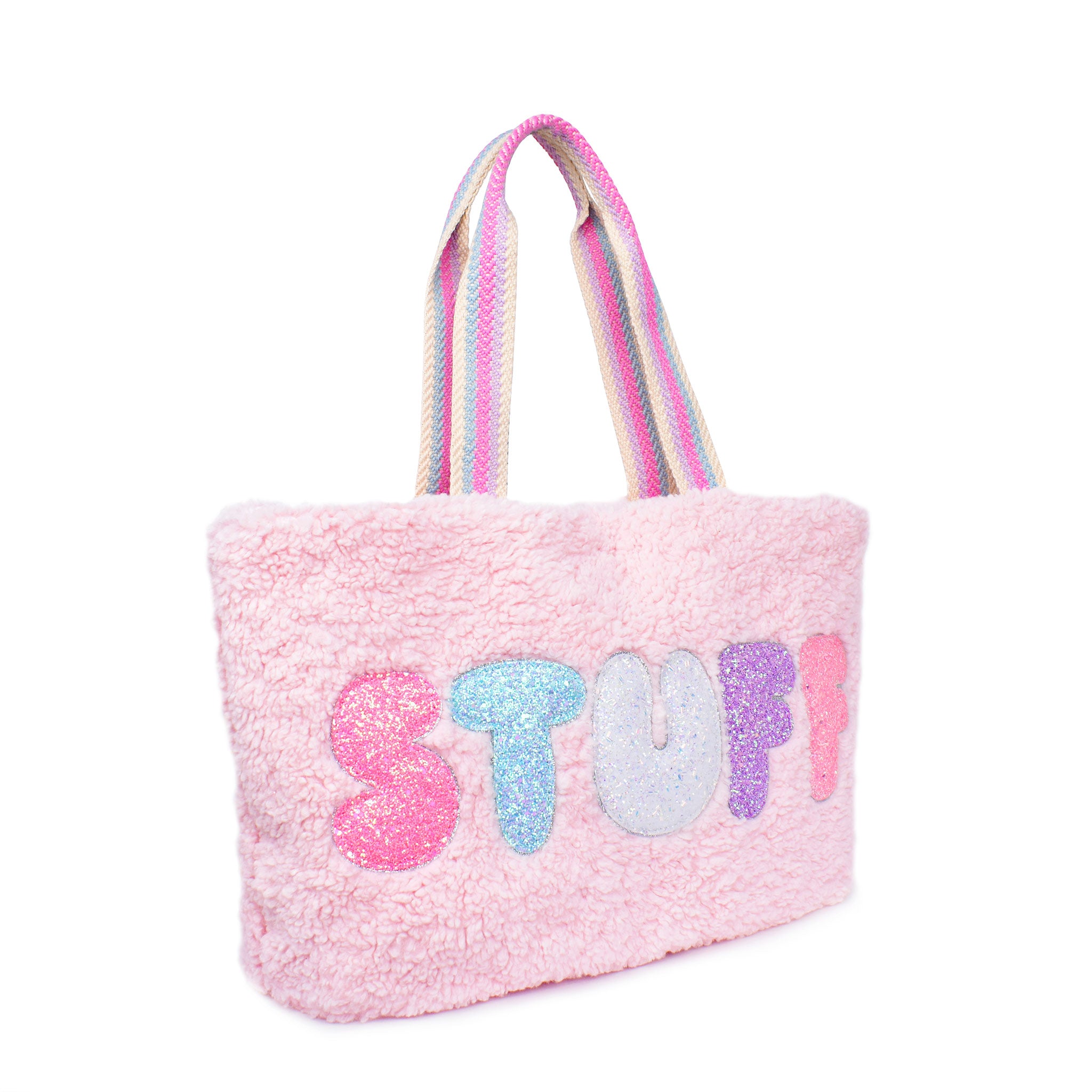Side view of a pink sherpa large tote bag with glitter bubble lettering 'STUFF'
