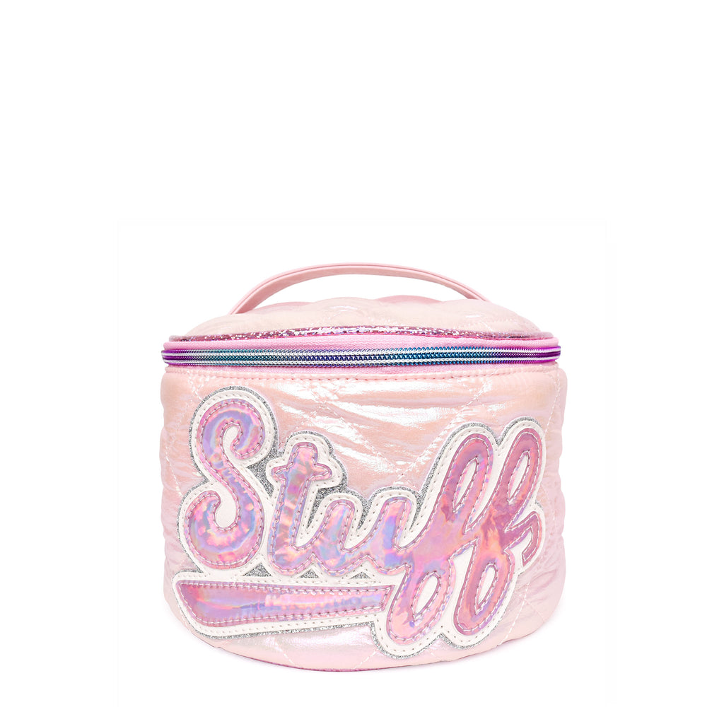 Front view of a light pink metallic quilted puffer round train case with scripted varsity letters 'STUFF'