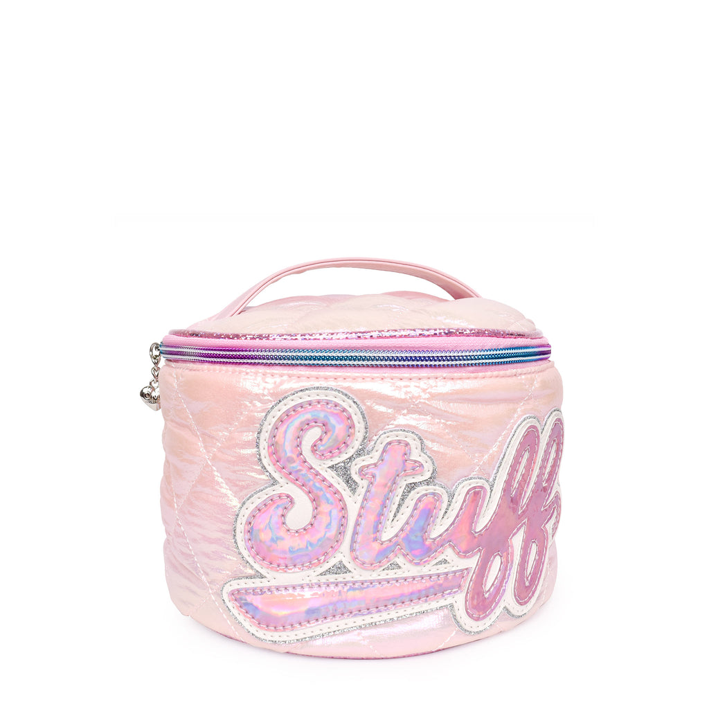 Side view of a light pink metallic quilted puffer round train case with scripted varsity letters 'STUFF'