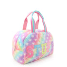 Side view of an ombre plush heart- printed medium duffle bag with glitter varsity lettering 'STUFF' appliqués