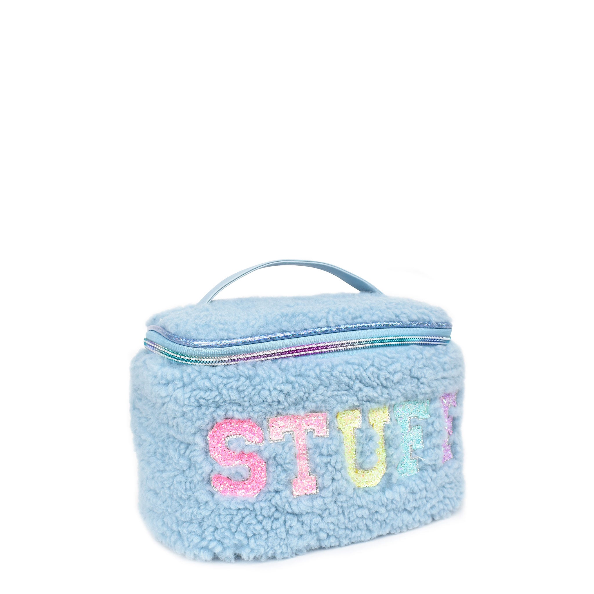 Side  view of a blue sherpa train case with glitter bubble letters 'STUFF' appliqué