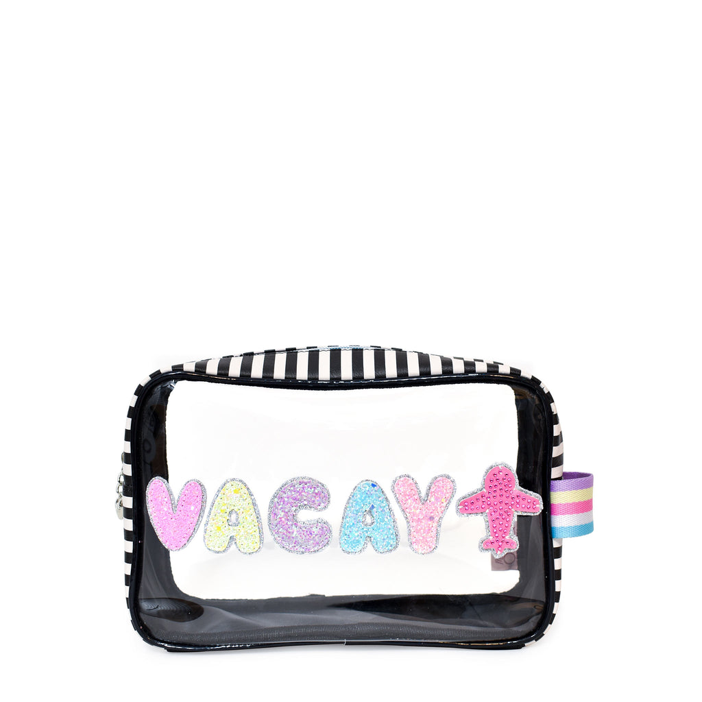 Front view of black-and-white striped 'Vacay' pouch with glitter bubble-letter patches and rhinestone airplane patch