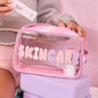 Photoshoot image of clear glitter bubble letter skincare pouch